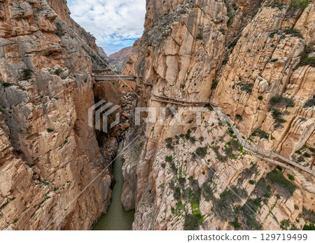 Caminito del Rey walking trail, Kings little pathway, Aerial Drone views of El Chorro Gorge, Ardales, Malaga, Spain. Caminito del Rey walking trail, Kings little pathway, Aerial Drone views of El Chorro Gorge, Ardales, Malaga, Spain. 129719499