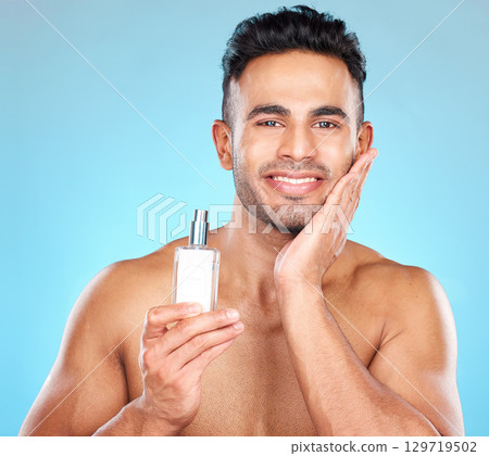 Portrait of man, fragrance and aftershave bottle product for skincare, wellness and luxury cosmetics on blue background. Happy young indian, male beauty and cologne, perfume and parfum body spray Portrait of man, fragrance and aftershave bottle product for skincare, wellness and luxury cosmetics on blue background. Happy young indian, male beauty and cologne, perfume and parfum body spray 129719502