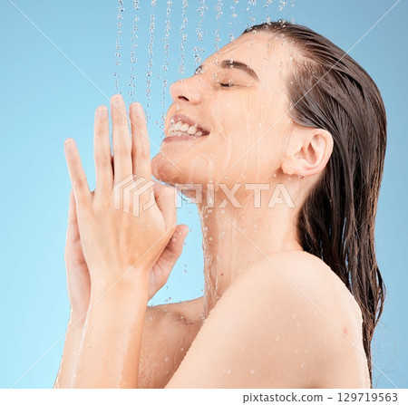 Happy, woman, and shower in studio for hair, skincare and grooming on blue background mockup. Girl, water splash and relax in a bathroom for skin, hair care and cleaning, wellness and beauty mock up Happy, woman, and shower in studio for hair, skincare and grooming on blue background mockup. Girl, water splash and relax in a bathroom for skin, hair care and cleaning, wellness and beauty mock up 129719563