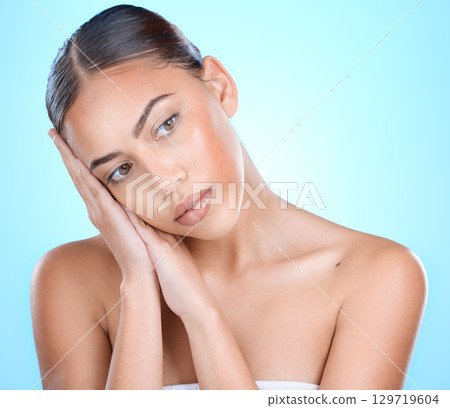 Beauty, face and makeup, woman and skincare with cosmetics, facial and wellness treatment for skin and healthy glow. Cosmetic mockup, clean and shine with self care against blue studio background. Beauty, face and makeup, woman and skincare with cosmetics, facial and wellness treatment for skin and healthy glow. Cosmetic mockup, clean and shine with self care against blue studio background. 129719604