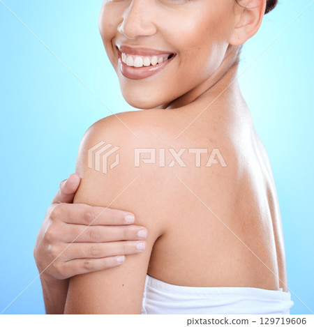 Beauty, wellness and healthy skincare woman with happy smile, luxury product or blue studio background with mockup. Skin care, happiness and advertising cosmetics product with female model with pride 129719606