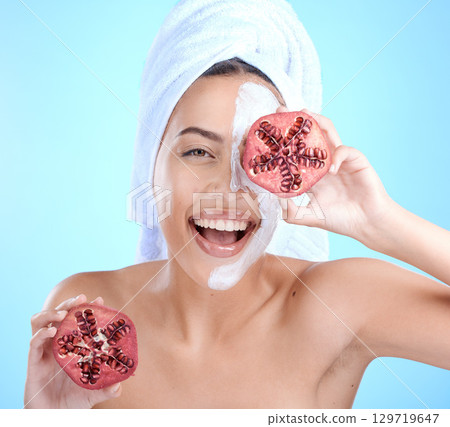 Woman, face mask and pomegranate for spa beauty, luxury skincare wellness and natural skin glow portrait in studio. .Model, happiness smile and facial dermatology or fruit cosmetics body nutrition 129719647