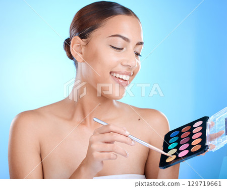 Makeup, cosmetics and woman with face brush and product happy about skincare and beauty. Model with happiness about luxury color cosmetic and eye cosmetology ready for self care with a smile Makeup, cosmetics and woman with face brush and product happy about skincare and beauty. Model with happiness about luxury color cosmetic and eye cosmetology ready for self care with a smile 129719661