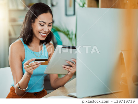 Online shopping with credit card and tablet while paying for her streaming subscription or bill. Happy woman enjoy break and online shopping or purchasing items on eCommerce website with fintech app 129719739