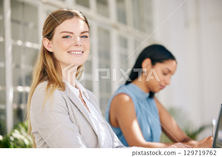Business woman, employee and worker with motivation and vision for success working in an office startup. Portrait of smile, happy and young professional, designer and creative staff in an agency 129719762