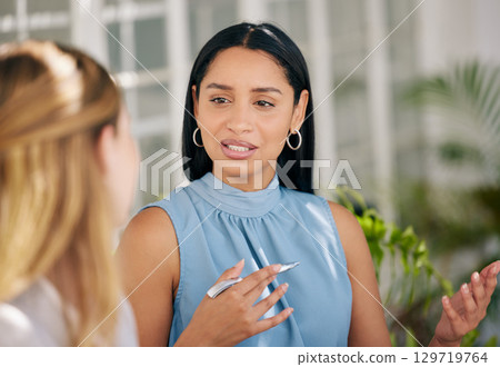 Manager, CEO or leader meeting with an employee and talking or discussing the vision, mission and plan for company growth and development. Teamwork, management and leadership in a corporate office 129719764