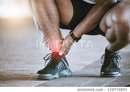 Sports, injury and fitness ankle pain during exercise, running and training outside with red color on foot, muscle or joint. Man, risk and hurt hands athlete holding broken leg bone with bad bruise Sports, injury and fitness ankle pain during exercise, running and training outside with red color on foot, muscle or joint. Man, risk and hurt hands athlete holding broken leg bone with bad bruise 129719803