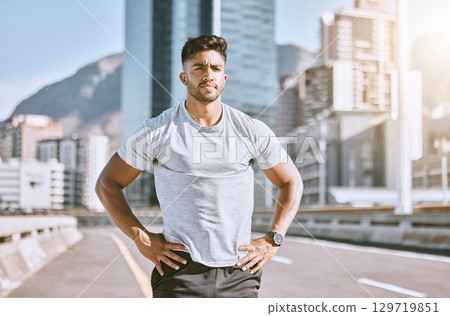 Serious sports man ready for fitness, workout and healthy exercise in urban city. Strong runner, thinking guy and determined athlete with motivation training for cardio run, marathon or jog outdoors Serious sports man ready for fitness, workout and healthy exercise in urban city. Strong runner, thinking guy and determined athlete with motivation training for cardio run, marathon or jog outdoors 129719851