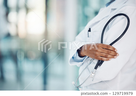 Black doctor hands, stethoscope and healthcare in hospital for medical leadership, wellness and clinic service. Closeup of cardiology expert, heart surgeon and professional african woman in medicine Black doctor hands, stethoscope and healthcare in hospital for medical leadership, wellness and clinic service. Closeup of cardiology expert, heart surgeon and professional african woman in medicine 129719979