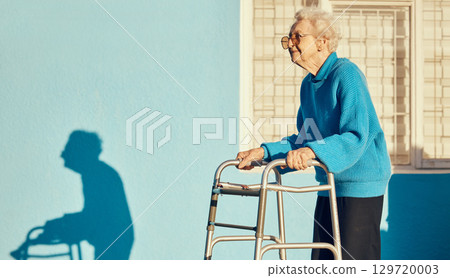 Senior, walker and woman in a city with a disability, osteoporosis or arthritis walking with wall mockup. Relax fitness from leg rehabilitation after surgery with a elderly female walk for health 129720003