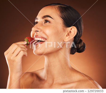 Beauty, skin and skincare, woman with strawberry in healthy, vegan and clean cosmetics product, facial and natural treatment against studio background. Fruit, wellness and organic make up advertising Beauty, skin and skincare, woman with strawberry in healthy, vegan and clean cosmetics product, facial and natural treatment against studio background. Fruit, wellness and organic make up advertising 129720033