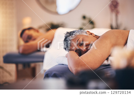 Mature couple, massage or spa date in relax hotel salon, healthcare wellness clinic or skincare beauty retreat. Woman, man or lying customer in aromatherapy treatment, stress management or self care 129720134