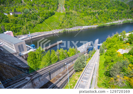 The boat lift at Orlik Dam showcases its engineering marvel as vessels are elevated between water levels. 129720169