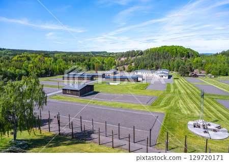 This memorial in Lesetice, Czechia, commemorates victims of communism at a former prison complex. Lush greenery surrounds the site, highlighting its somber history and significance. This memorial in Lesetice, Czechia, commemorates victims of communism at a former prison complex. Lush greenery surrounds the site, highlighting its somber history and significance. 129720171