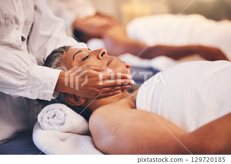 Spa, facial and massage of senior woman for peace, relaxation and wellness procedure lifestyle. Health, physical therapy and masseuse at luxury resort massaging client on salon treatment bed. Spa, facial and massage of senior woman for peace, relaxation and wellness procedure lifestyle. Health, physical therapy and masseuse at luxury resort massaging client on salon treatment bed. 129720185