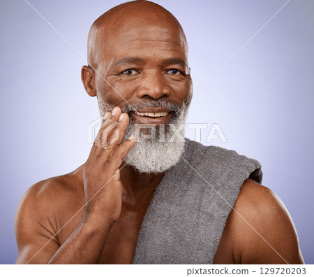 Portrait, black man and towel for shower, healthy skincare and good personal hygiene on studio purple background. Mature guy touching clean face, body care cosmetics and male beauty, wellness and spa Portrait, black man and towel for shower, healthy skincare and good personal hygiene on studio purple background. Mature guy touching clean face, body care cosmetics and male beauty, wellness and spa 129720203