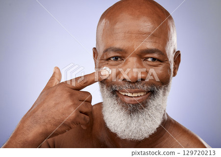Beauty, skincare and product with portrait of black man and facial cream for sunscreen, wellness and dermatology. Moisturizer, self care and lotion on face of old man for cosmetics, luxury and glow 129720213