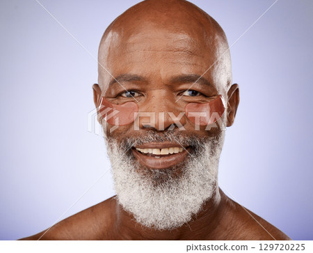 Eye patches, skincare and senior man wellness, face health and dermatology collagen on purple background in studio. Beauty smile, elderly product and portrait of a facial model for aging cosmetics 129720225