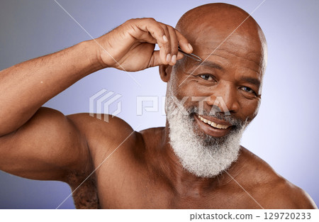 Tweezer, man and beauty portrait of senior male remove eyebrow hair on a grey studio background. Face, african American male and haircare with tweeze epilation or hair removal on a studio backdrop Tweezer, man and beauty portrait of senior male remove eyebrow hair on a grey studio background. Face, african American male and haircare with tweeze epilation or hair removal on a studio backdrop 129720233
