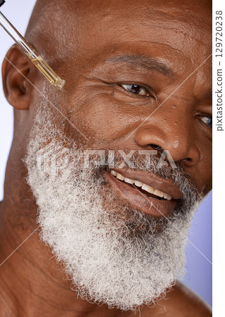 Skincare, oil and happy, senior and man in studio for facial, wellness and serum product, wrinkles and hydration closeup. Zoom, face and skin, hyaluronic acid or retinol for elderly man beauty Skincare, oil and happy, senior and man in studio for facial, wellness and serum product, wrinkles and hydration closeup. Zoom, face and skin, hyaluronic acid or retinol for elderly man beauty 129720238