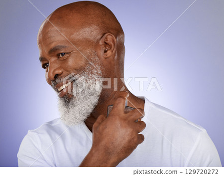 Man, perfume and cologne bottle on studio background for mature cosmetics, luxury wellness or body spray. Smile, happy and black model with parfum fragrance on purple mock up backdrop for clean smell 129720272