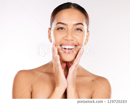 Portrait of woman, skincare and beauty cosmetics for shine, wellness or healthy glow on studio background. Happy model touching face after facial laser aesthetics, chemical peel and clean dermatology 129720283