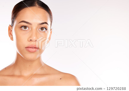 Skincare, beauty and portrait of Latin woman on a white background studio for dermatology, body care and heath. Wellness, spa and face of girl with facial treatment, skincare products and cosmetics 129720288