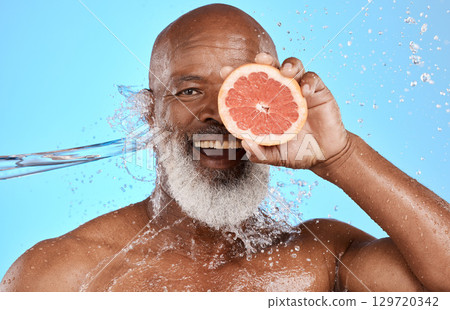 Grapefruit, portrait and senior black man in studio with water splash for bathroom product, skincare and vitamin c health promotion. Smile face, fruit and an african elderly model with facial glow Grapefruit, portrait and senior black man in studio with water splash for bathroom product, skincare and vitamin c health promotion. Smile face, fruit and an african elderly model with facial glow 129720342