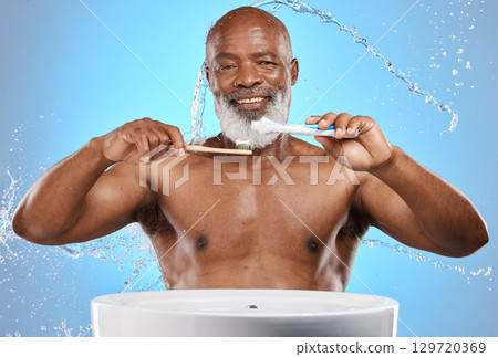 Brushing teeth, bamboo and black man in studio with toothpaste for dental or mouth care product promotion on blue mockup. Senior black man portrait, eco friendly or wood toothbrush and water splash 129720369