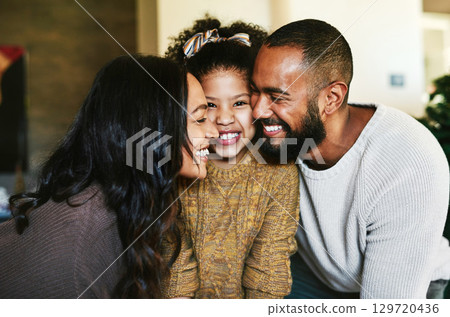 Black family, love and happiness portrait with a mother, father and child together with a smile, support and hug for gratitude. Man, woman and girl daughter bonding in the lounge while happy at home Black family, love and happiness portrait with a mother, father and child together with a smile, support and hug for gratitude. Man, woman and girl daughter bonding in the lounge while happy at home 129720436
