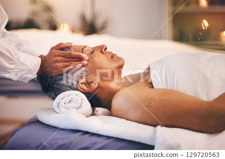 Hands, old woman and head massage at spa for wellness, relax and stress relief. Luxury, zen and peace with elderly female on table with masseuse for physical therapy, skincare or facial treatment. Hands, old woman and head massage at spa for wellness, relax and stress relief. Luxury, zen and peace with elderly female on table with masseuse for physical therapy, skincare or facial treatment. 129720563