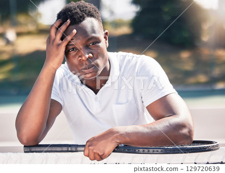 Black man, tennis and stress, anxiety with fitness and outdoor on tennis court, holding head and frustrated, game fail or mistake in training. Exercise, wellness and sport portrait with angry athlete Black man, tennis and stress, anxiety with fitness and outdoor on tennis court, holding head and frustrated, game fail or mistake in training. Exercise, wellness and sport portrait with angry athlete 129720639
