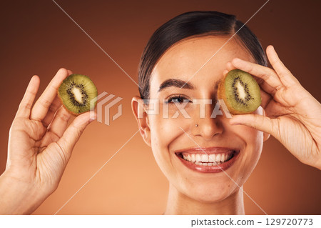 Skincare, beauty and portrait of woman with kiwi for natural, organic and natural beauty product for skin. Luxury spa, wellness and face of girl with fruit for cosmetics, facial and skincare products Skincare, beauty and portrait of woman with kiwi for natural, organic and natural beauty product for skin. Luxury spa, wellness and face of girl with fruit for cosmetics, facial and skincare products 129720773