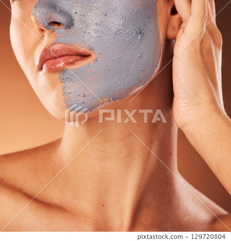Facial mask, skincare and beauty of a woman face doing self care, health and wellness for skin. Face cleaning, dermatology and relax cosmetic cream of a model doing luxury clay product treatment 129720804