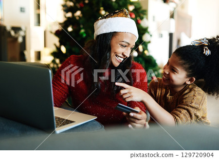 Christmas, laptop and credit card with mother and girl for online shopping, gift or digital payment. Fintech, ecommerce and purchase with mom and child customer for celebration, holiday and xmas deal 129720904