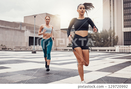 Women, running and fitness in city with cardio, exercise friends and active lifestyle together in Cape Town. Sports, health and body training, runner run race on urban rooftop with healthy people Women, running and fitness in city with cardio, exercise friends and active lifestyle together in Cape Town. Sports, health and body training, runner run race on urban rooftop with healthy people 129720992