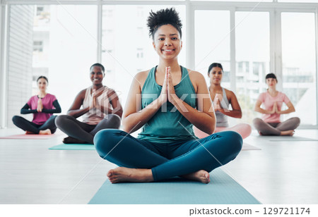 Black woman, yoga portrait and meditation with zen exercise for fitness, peace and wellness. Instructor and diversity group in gym class for prayer hands holistic workout, mental health and body 129721174