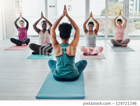 Diversity women in yoga class for meditation exercise for fitness, peace and wellness. Group and instructor in gym studio for holistic workout, mental health and body balance with zen prayer hands 129721196
