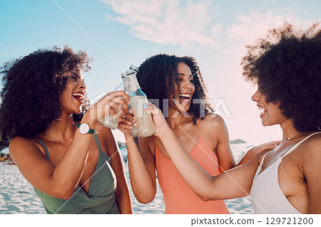 Alcohol, toast and beach with black woman friends having fun together during summer on the coast. Drinking, cheers and bonding with a female and friend on the sand by the ocean or sea for vacation Alcohol, toast and beach with black woman friends having fun together during summer on the coast. Drinking, cheers and bonding with a female and friend on the sand by the ocean or sea for vacation 129721200