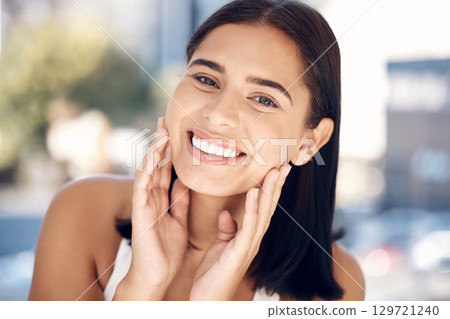 Face, beauty and skincare with a woman in the bathroom of her home for facial cleaning or hygiene. Portrait, skin and cosmetics with an attractive young female applying luxury product to her skin Face, beauty and skincare with a woman in the bathroom of her home for facial cleaning or hygiene. Portrait, skin and cosmetics with an attractive young female applying luxury product to her skin 129721240