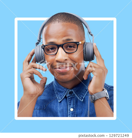 Black woman, portrait and headphones for music with a smile for motivation with blue background. Face of African model person listening to podcast or audio with color wallpaper backdrop in studio Black woman, portrait and headphones for music with a smile for motivation with blue background. Face of African model person listening to podcast or audio with color wallpaper backdrop in studio 129721249