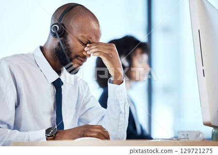 Depression, burnout and stress by call center worker, employee and customer service consultant in office. Pain, mental health and headache telemarking agent overworked and frustrated at the workplace 129721275