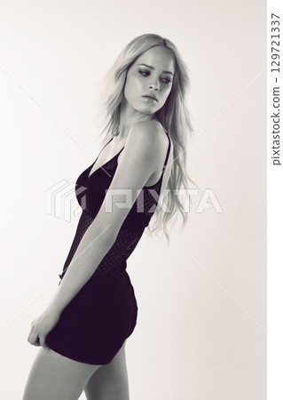 Fashion clothes, dress and beauty woman with luxury brand apparel, sexy designer outfit and creative monochrome aesthetic. Attitude, style and cool fashion model on black and white studio background Fashion clothes, dress and beauty woman with luxury brand apparel, sexy designer outfit and creative monochrome aesthetic. Attitude, style and cool fashion model on black and white studio background 129721337