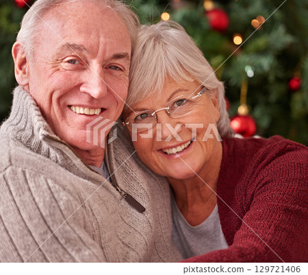 Senior couple, portrait and happy christmas in home, house and happiness, love and care together for winter holiday. Man, woman and old people, retirement and festive, merry xmas and celebration joy Senior couple, portrait and happy christmas in home, house and happiness, love and care together for winter holiday. Man, woman and old people, retirement and festive, merry xmas and celebration joy 129721406