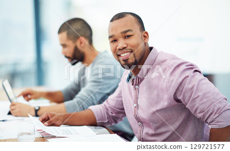 Businessman, documents and smile at desk with coworker in financial planning, analysis and strategy. Black man, happy and finance data on paper at desk for budget, teamwork or corporate partnership 129721577