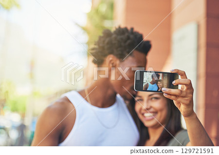 Phone, happy or black couple with selfie kiss for love, happiness or bonding in city, street or town. Photo, smile or man and woman with 5g smartphone for social media, media app or blog upload Phone, happy or black couple with selfie kiss for love, happiness or bonding in city, street or town. Photo, smile or man and woman with 5g smartphone for social media, media app or blog upload 129721591