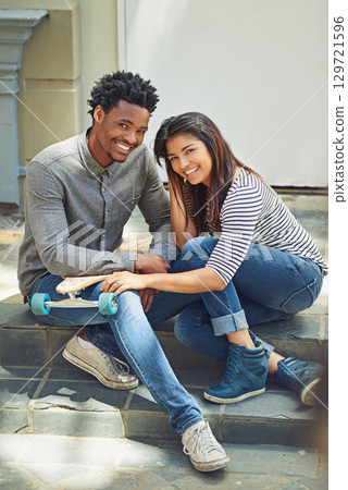 Portrait, skateboard and friends relaxing in the city while bonding with happiness for fun. Skater, man and woman with friendship bond for active lifestyle in an urban town while skateboarding Portrait, skateboard and friends relaxing in the city while bonding with happiness for fun. Skater, man and woman with friendship bond for active lifestyle in an urban town while skateboarding 129721596