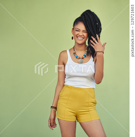 Fashion, portrait and natural black woman with braids enjoying youth, vacation and summer freedom. Happy, wellness and excited smile of young Jamaican girl standing at green background mock up. Fashion, portrait and natural black woman with braids enjoying youth, vacation and summer freedom. Happy, wellness and excited smile of young Jamaican girl standing at green background mock up. 129721603