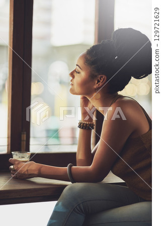 Black woman thinking, drinking coffee and cafe, dreaming of ideas and planning vision, solution or daydream, goals and question memory. Girl, restaurant and inspiration, mindset and relax at window 129721629