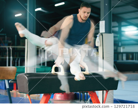 Gymnastics, fitness and man on balance beam for training, cardio and strength at gym. Athletic, male and acrobat practice speed, control and sport routine for muscle, power or endurance performance 129721718